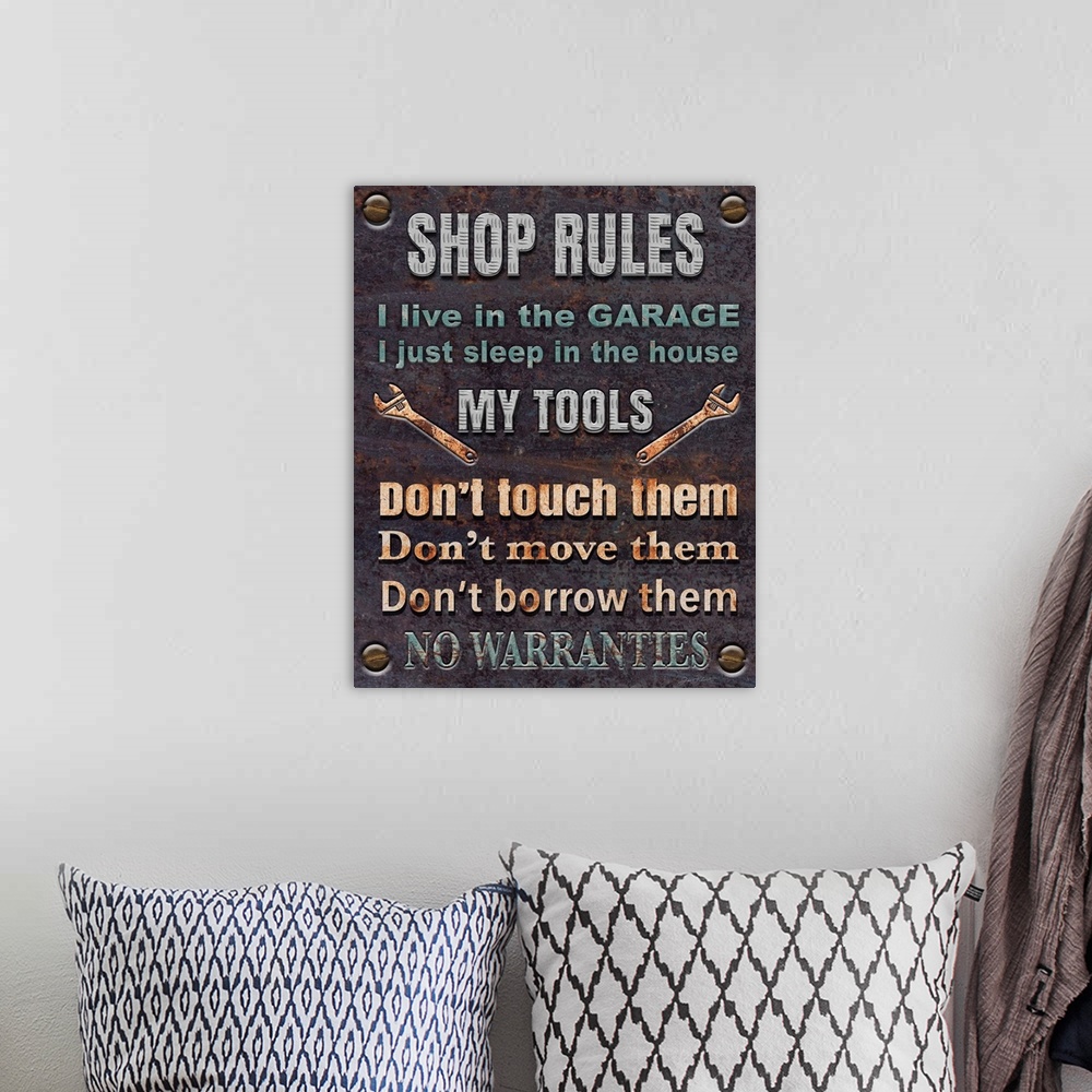 A bohemian room featuring Contemporary home decor artwork of a rustic looking garage shop sign with shop rules.