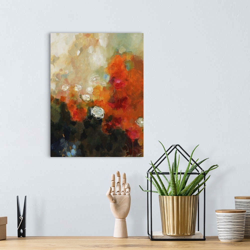 A bohemian room featuring Abstract painting of white flowers on an orange and black background.