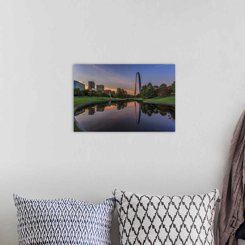 A bohemian room featuring A photograph of a St. Louis Missouri at sunset.