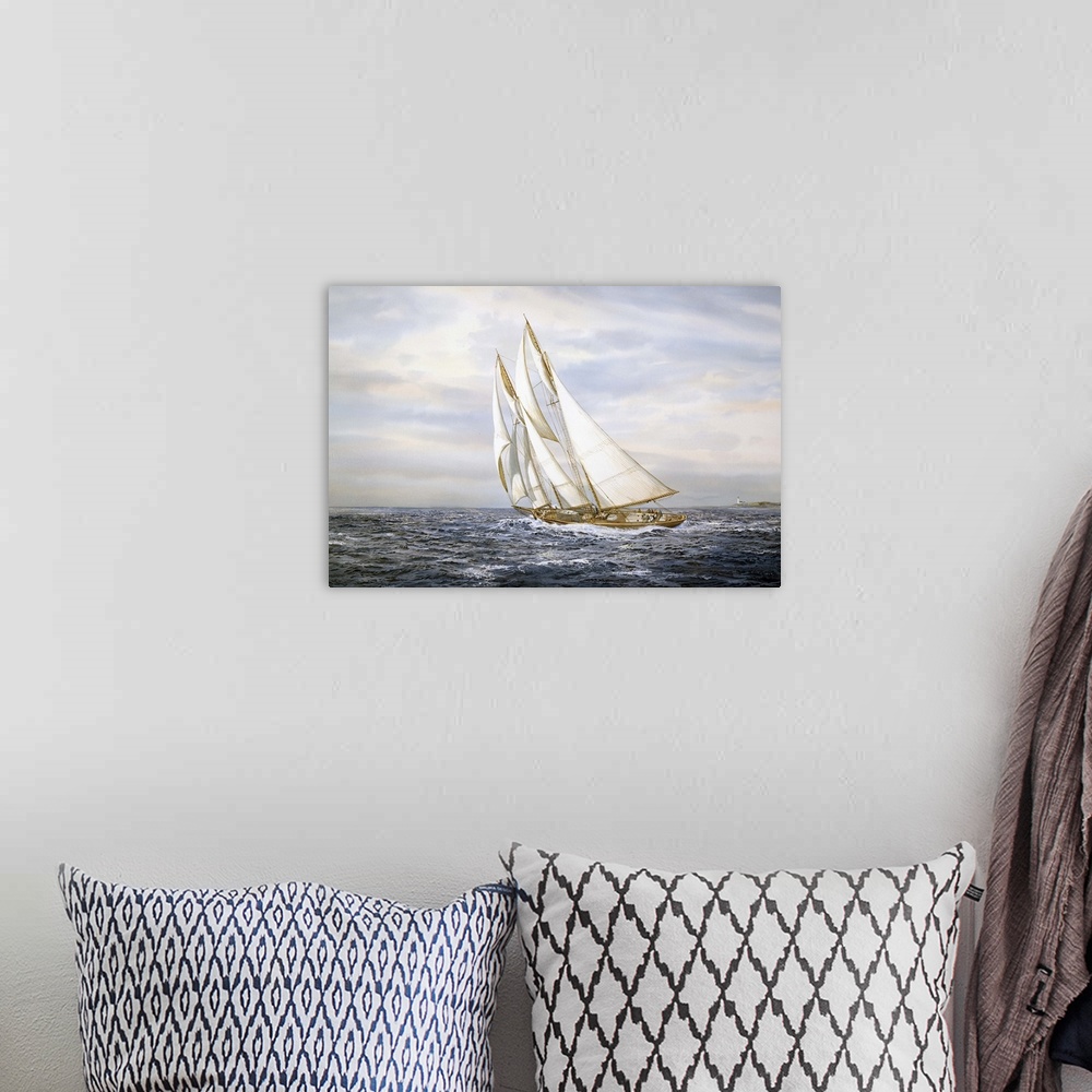 A bohemian room featuring A ship with large sails sailing on ocean.