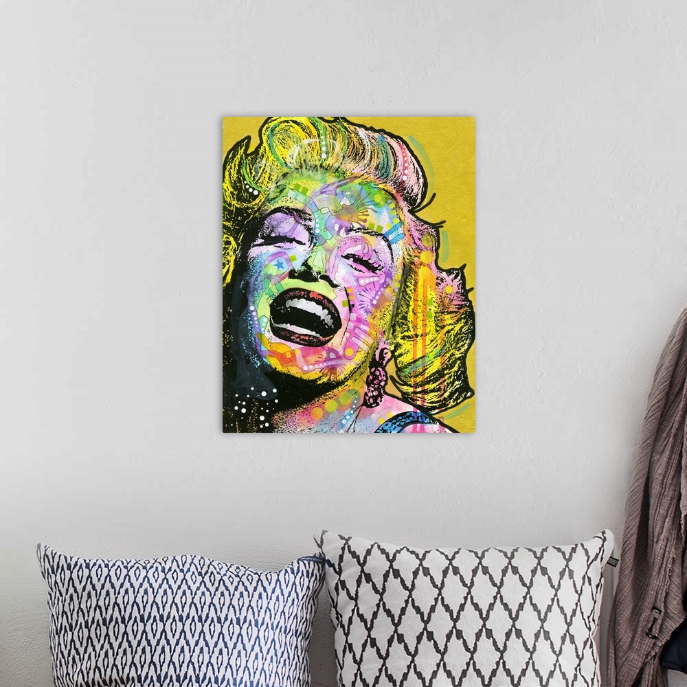 A bohemian room featuring Colorful portrait of Marilyn Monroe with graffiti-like designs on a gold background.