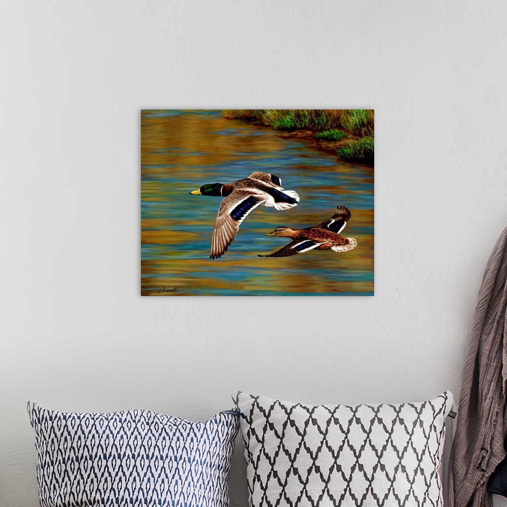 A bohemian room featuring Two ducks flying over the water