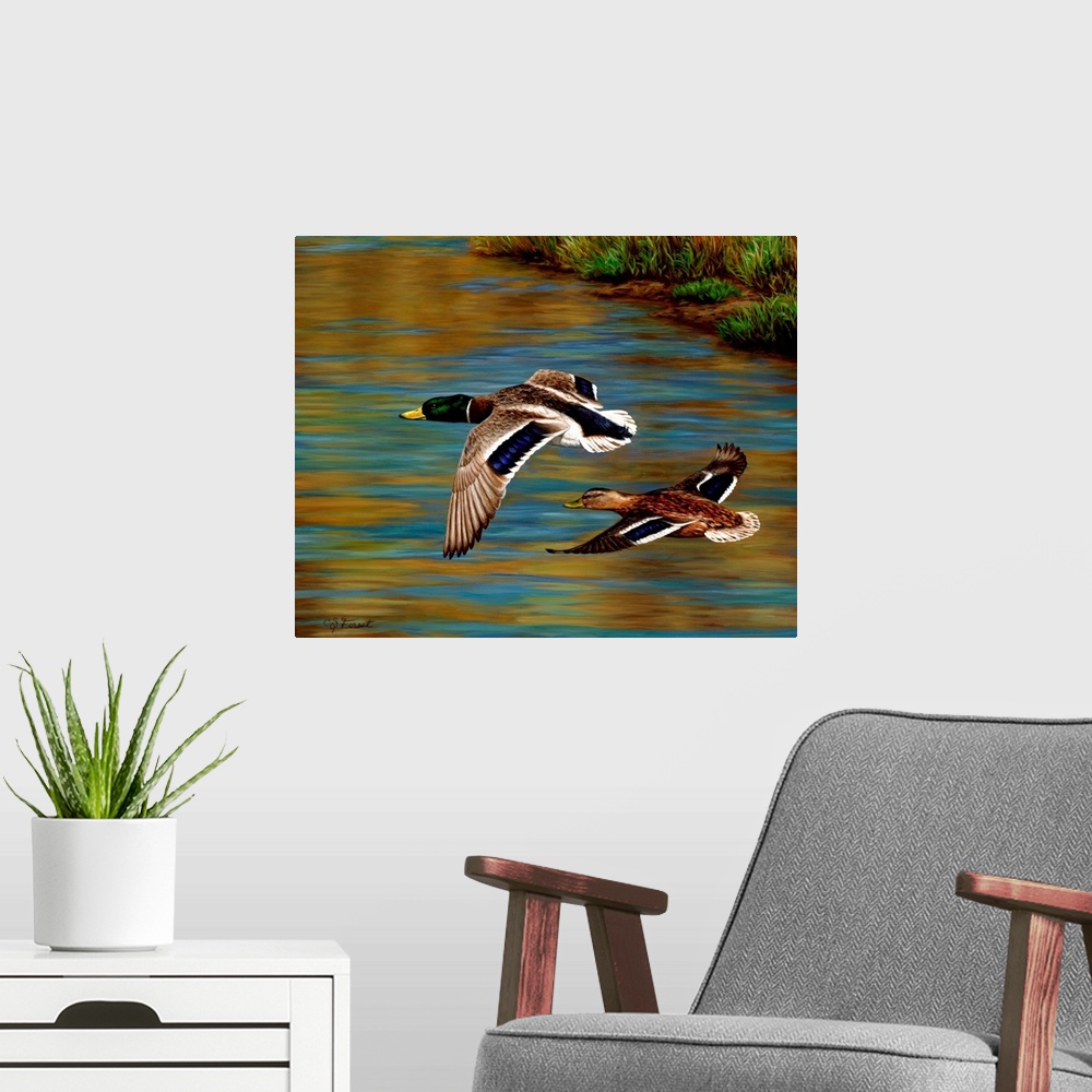 A modern room featuring Two ducks flying over the water