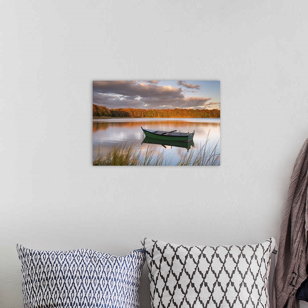 A bohemian room featuring Photograph of a green row boat sitting on the still water of a woodland pond.