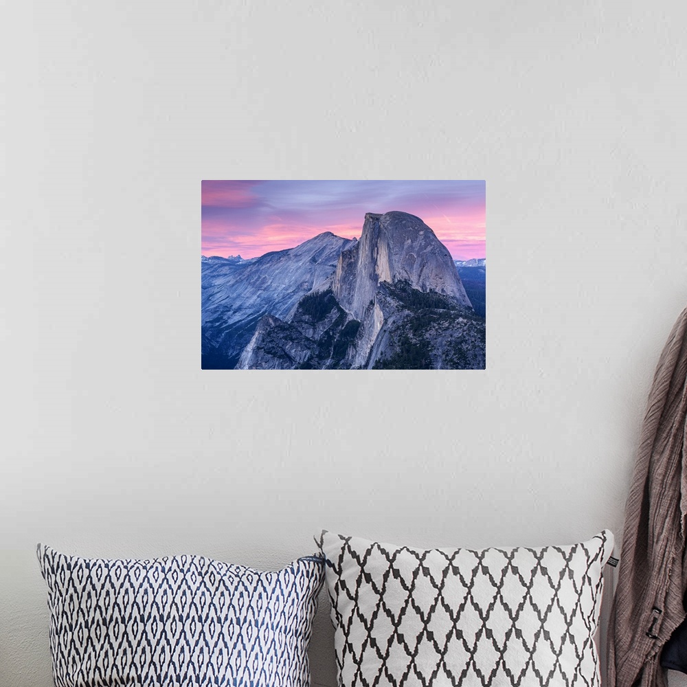 A bohemian room featuring Half Dome in Yosemite with pink clouds in the sky.