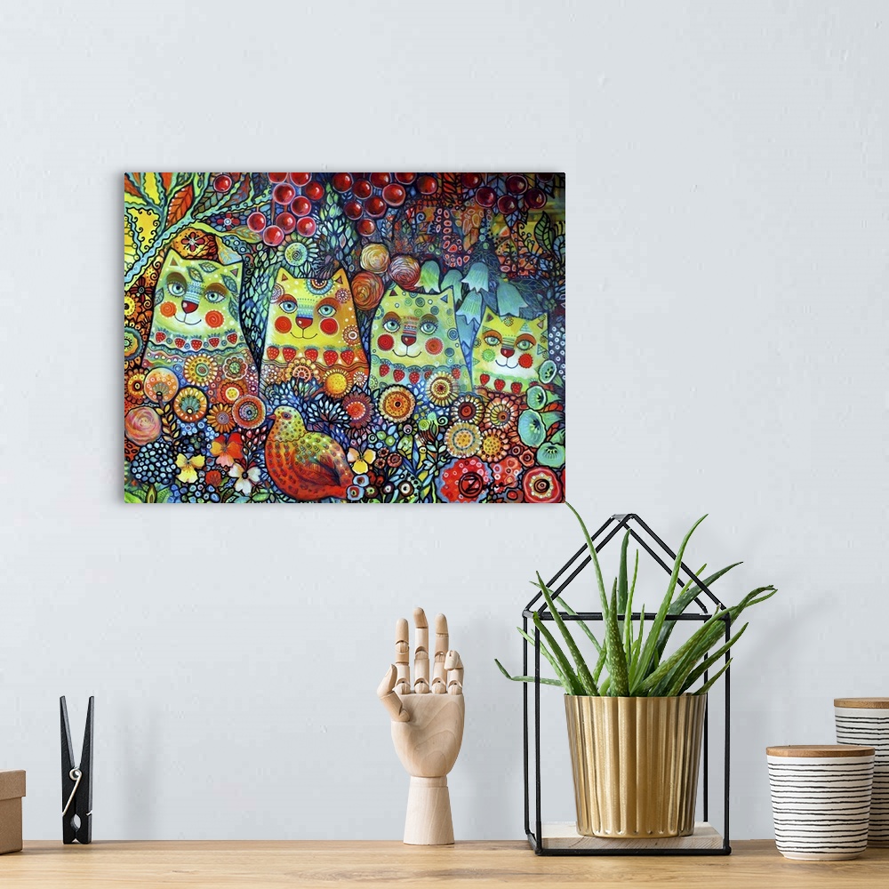 A bohemian room featuring Watercolor painting of a group of four cats sitting in brightly colored flowers.
