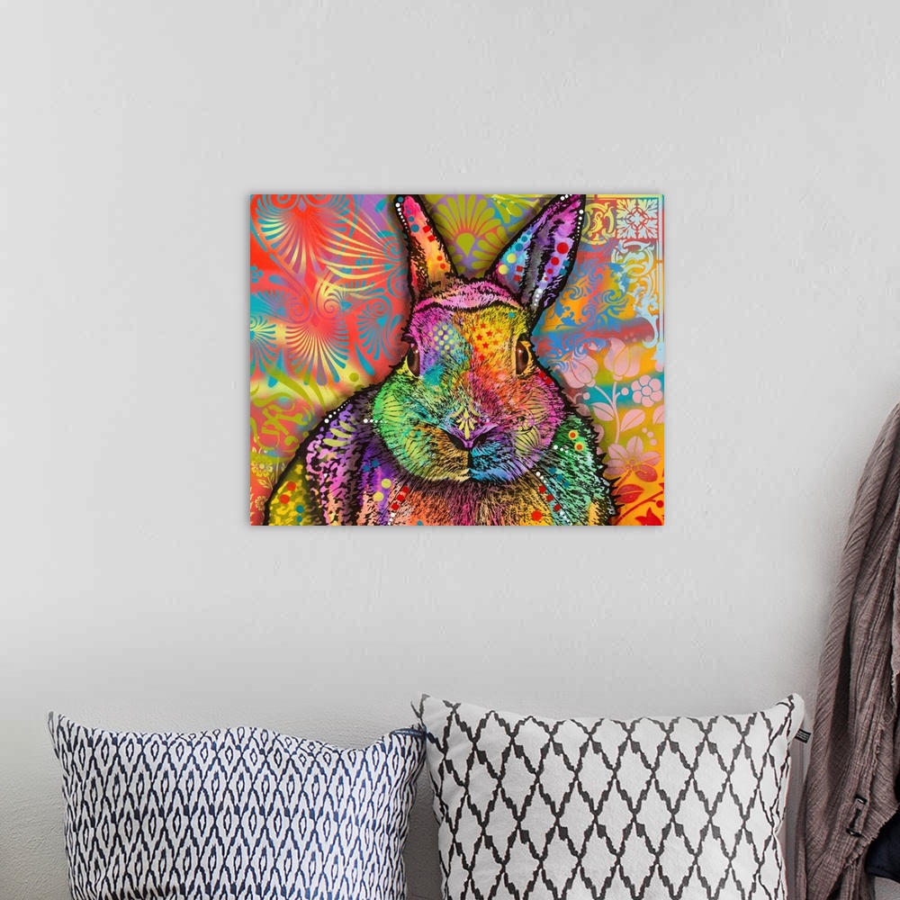 A bohemian room featuring Very colorful painting of a rabbit with abstract and floral designs all over.