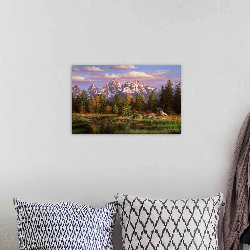 A bohemian room featuring Landscape painting of river and mountains.