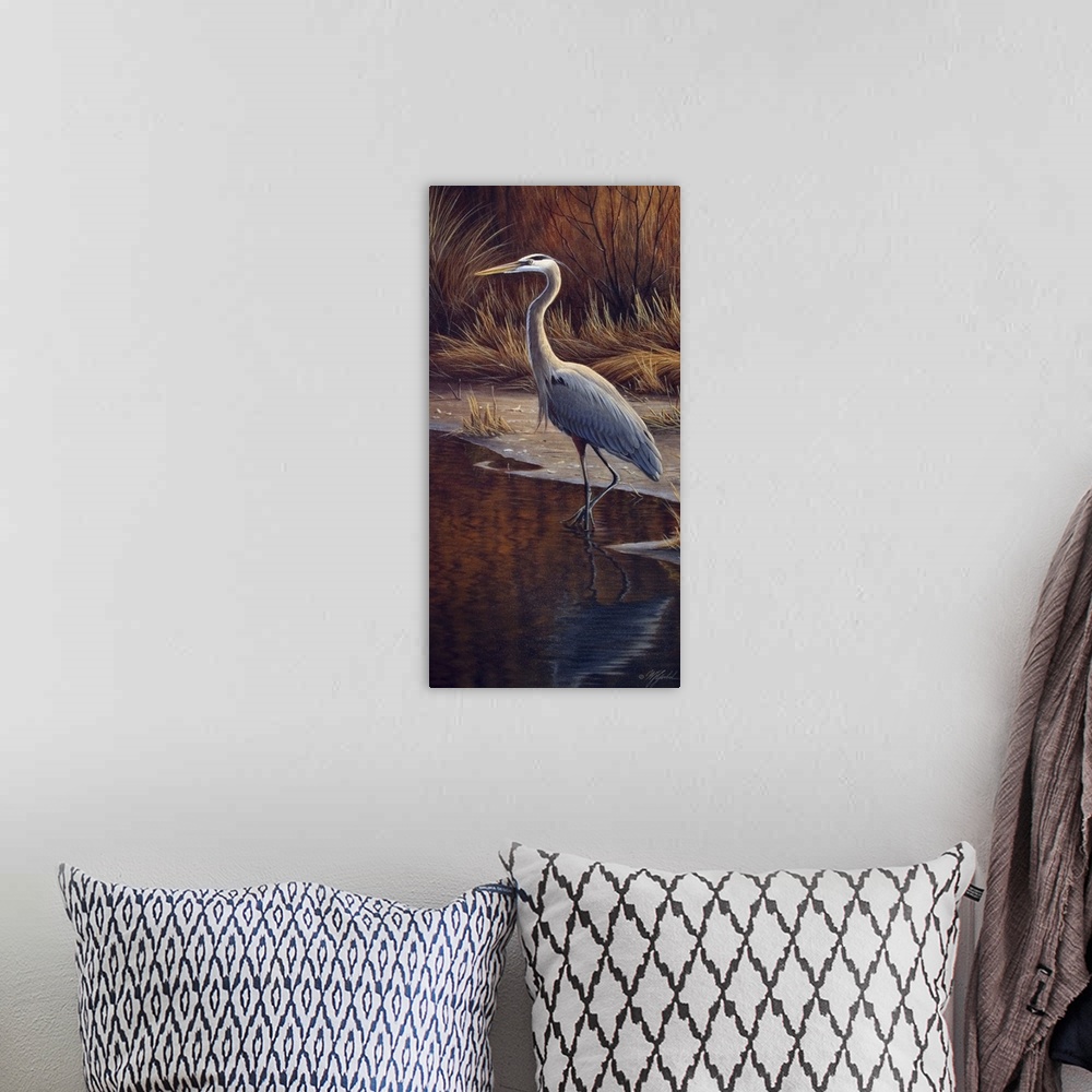 A bohemian room featuring Heron standing at the edge of the water.