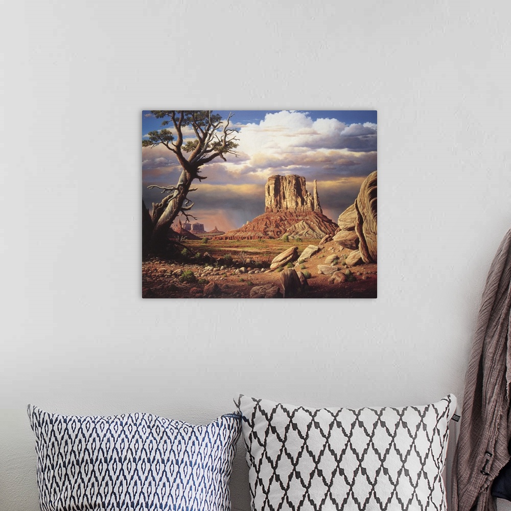 A bohemian room featuring Tree in desert with plateau in background.