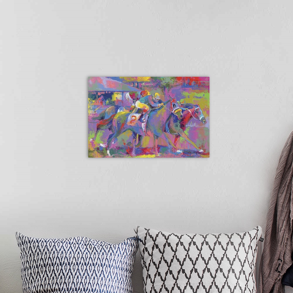 A bohemian room featuring Colorful vibrant painting of jockey's riding horses in a race.