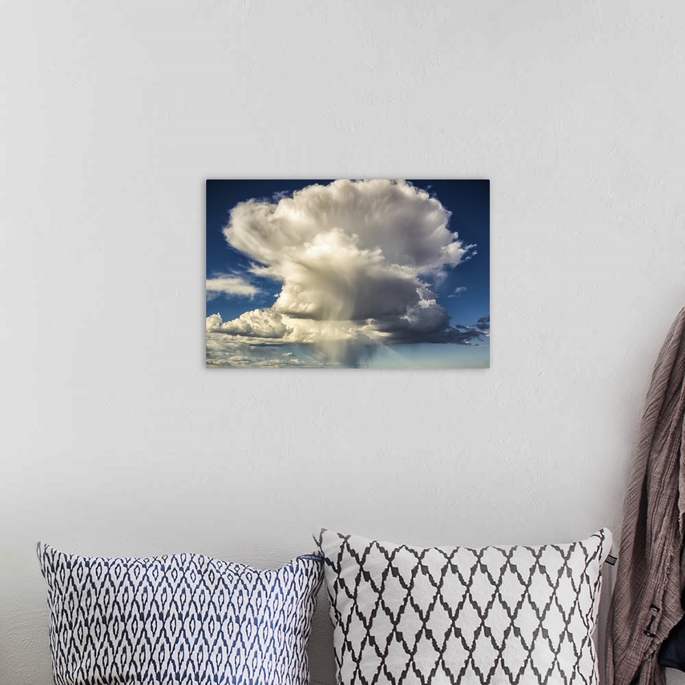 A bohemian room featuring Large cloud formation, color photography