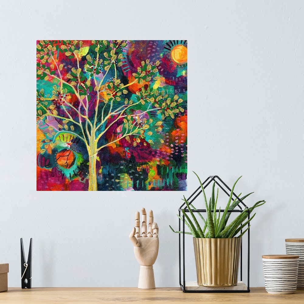 A bohemian room featuring Abstract painting of a golden tree on a busy, colorful, square background with a sun on each side.