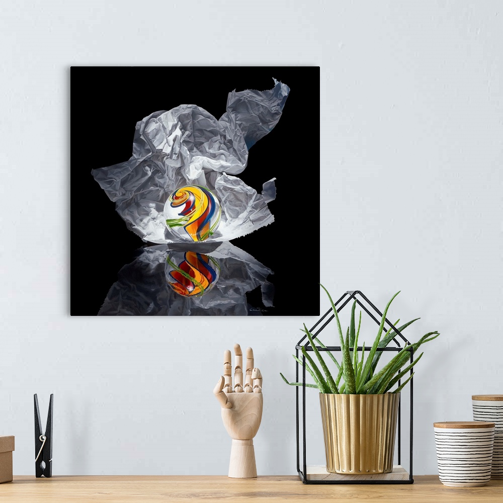 A bohemian room featuring Contemporary vivid realistic still-life painting of a marble with a swirl of color inside it with...