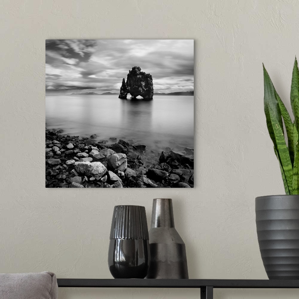 A modern room featuring Iceland Dinosaur, rocks out in the water, black and white photography