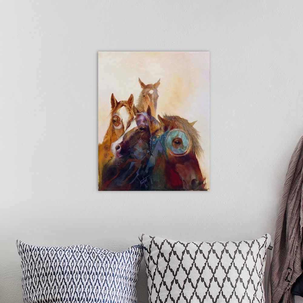 A bohemian room featuring Contemporary painting of wild horses painted in Native American regalia.