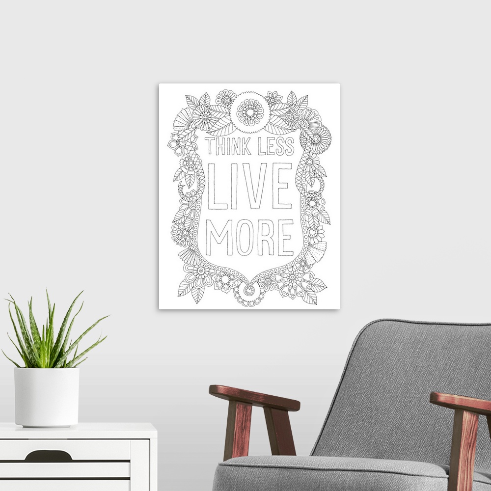 A modern room featuring Black and white line art of a floral design with the phrase "Think Less Live More" written in the...