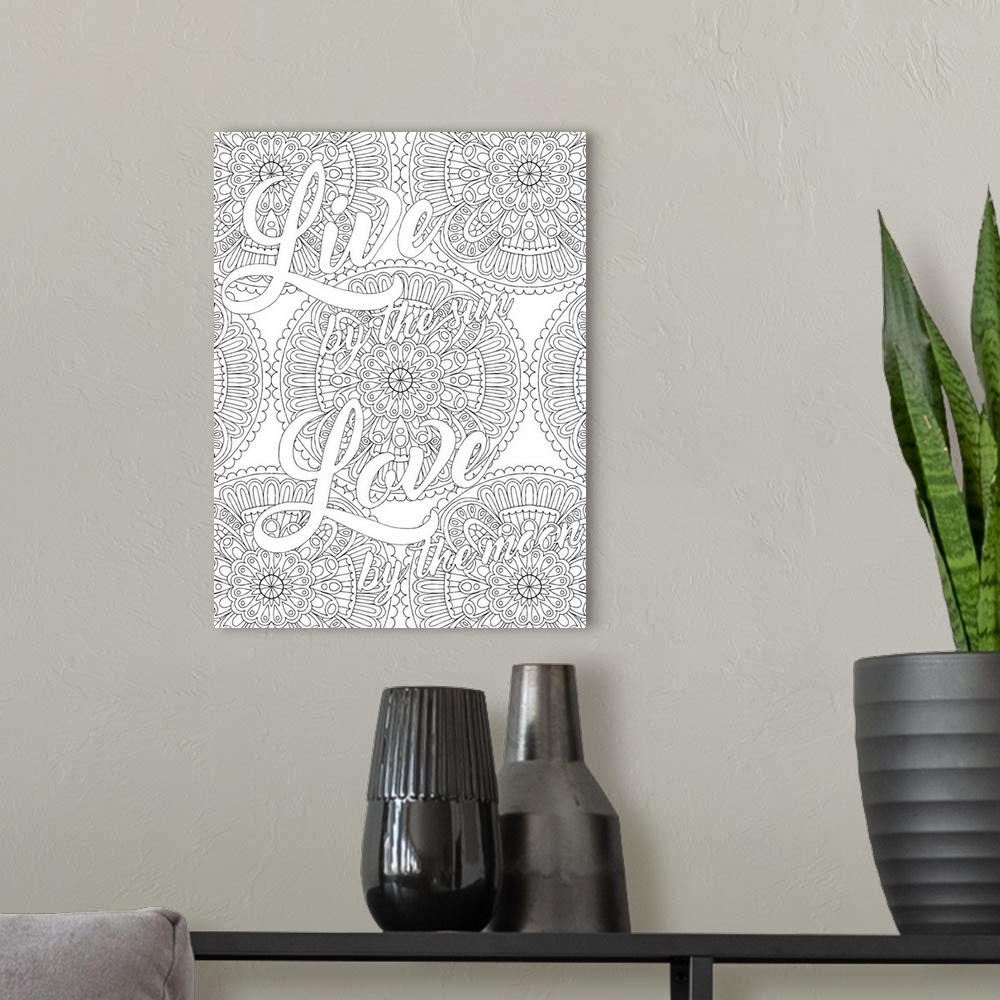A modern room featuring Inspirational black and white line art with the phrase "Live by the Sun Love by the Moon" written...