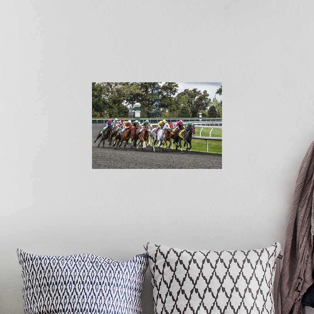 A bohemian room featuring Photograph of a a horse race at full speed rounding a curve.