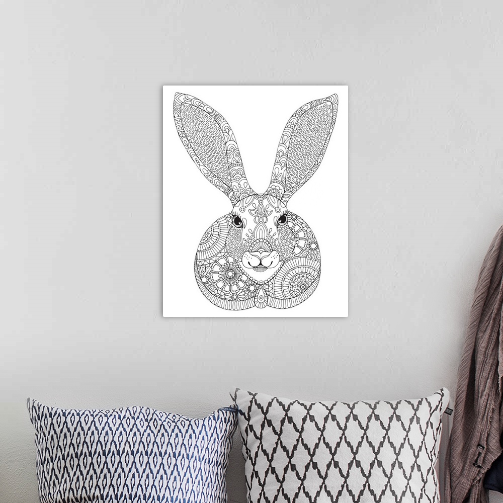 A bohemian room featuring Black and white line art of an intricately designed rabbit with long ears.