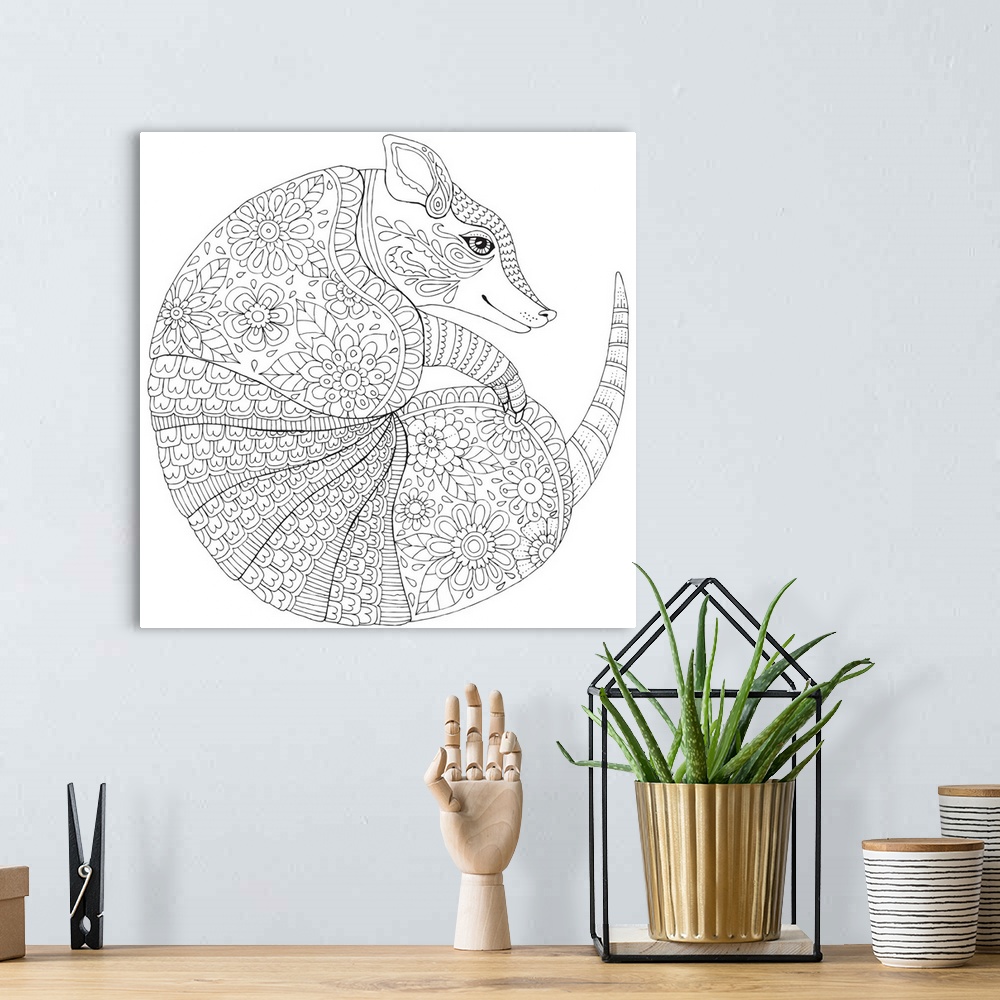 A bohemian room featuring Black and white lined design of an armadillo curled up.