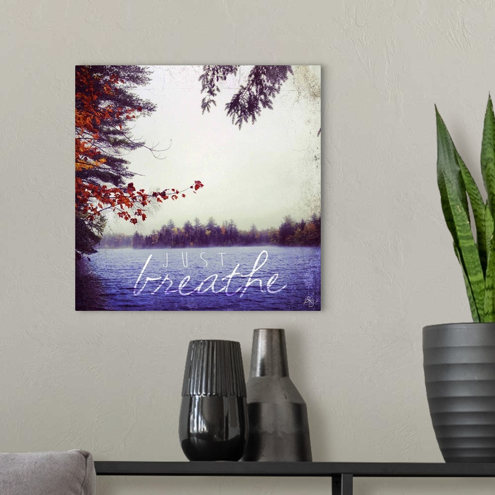 A modern room featuring Motivational text against background photograph of a serene lake.