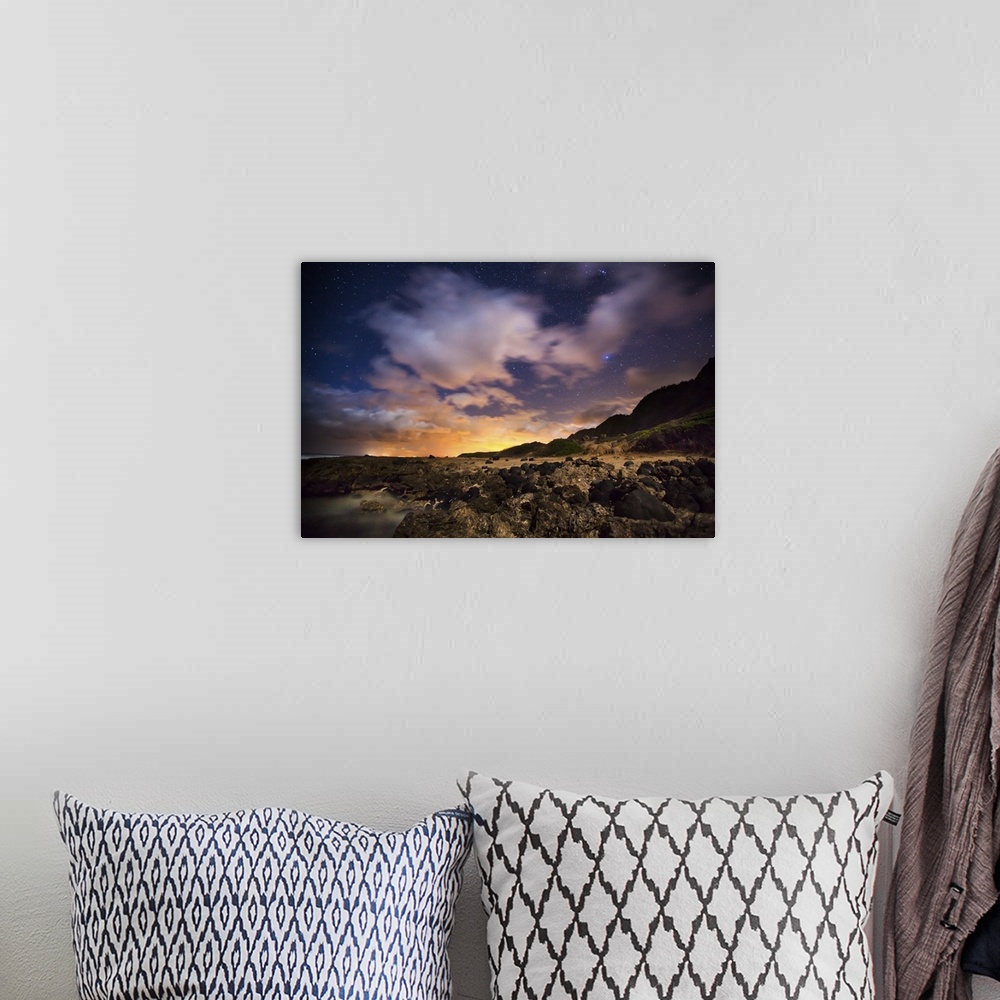A bohemian room featuring A photograph of a vibrant sunset over Hawaiian islands.