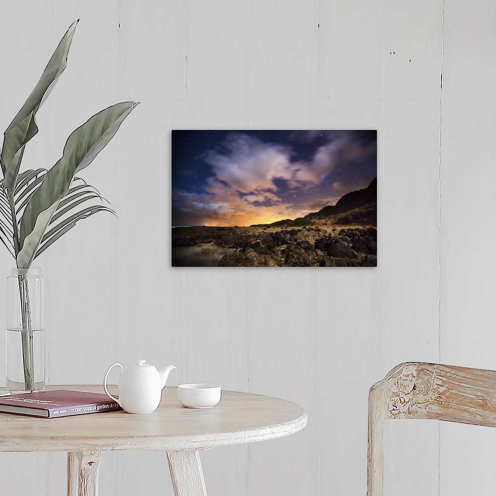 A farmhouse room featuring A photograph of a vibrant sunset over Hawaiian islands.