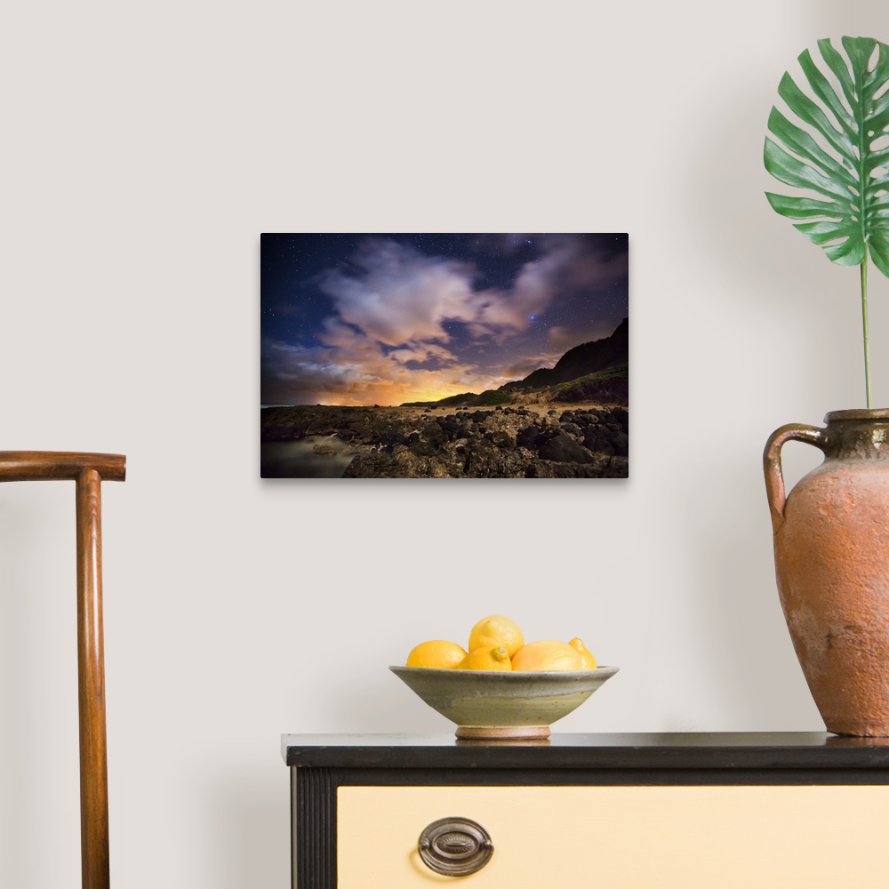 A traditional room featuring A photograph of a vibrant sunset over Hawaiian islands.