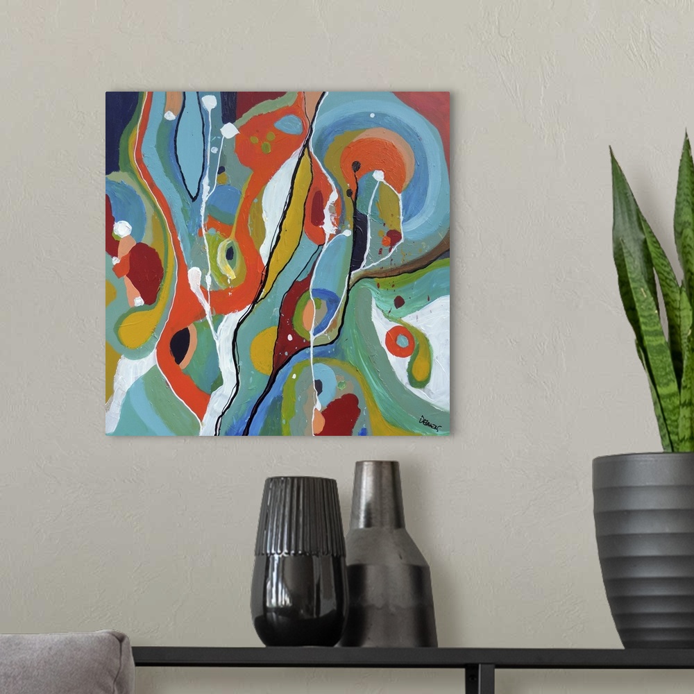A modern room featuring Contemporary abstract painting using wild colors and shapes.