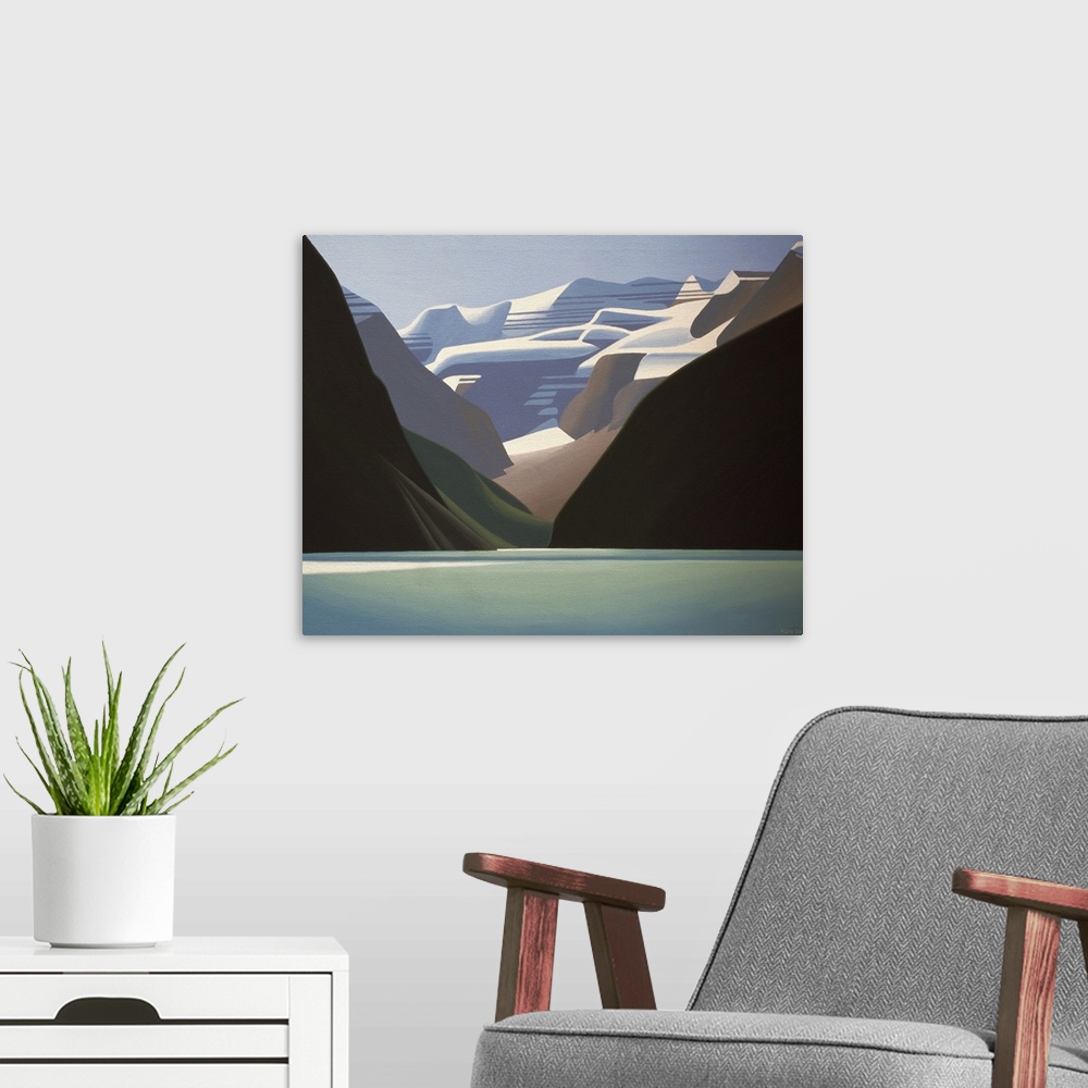 A modern room featuring Water in foreground with snow capped mountains rising up behind.