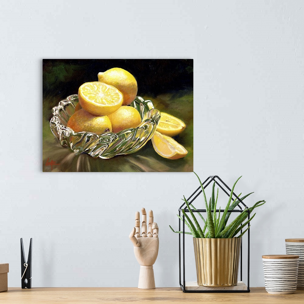 A bohemian room featuring Still life painting of four lemons, one sliced, in a glass dish.