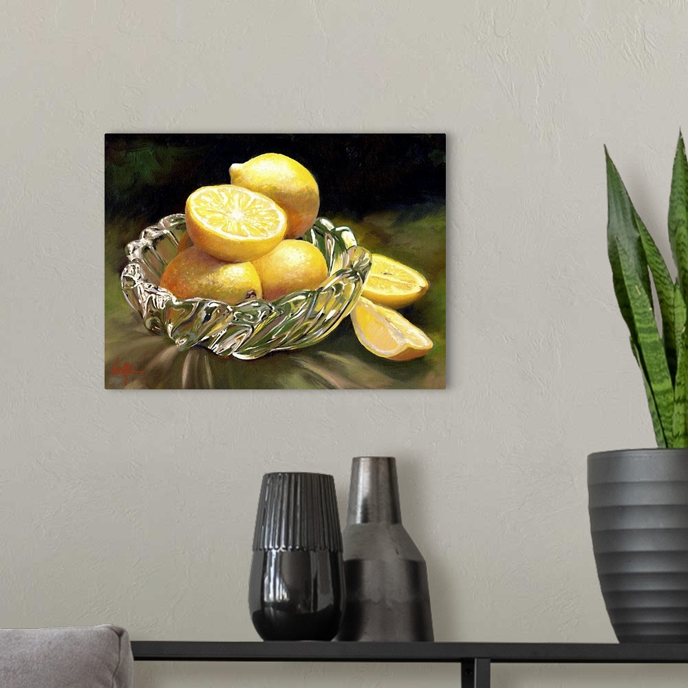 A modern room featuring Still life painting of four lemons, one sliced, in a glass dish.