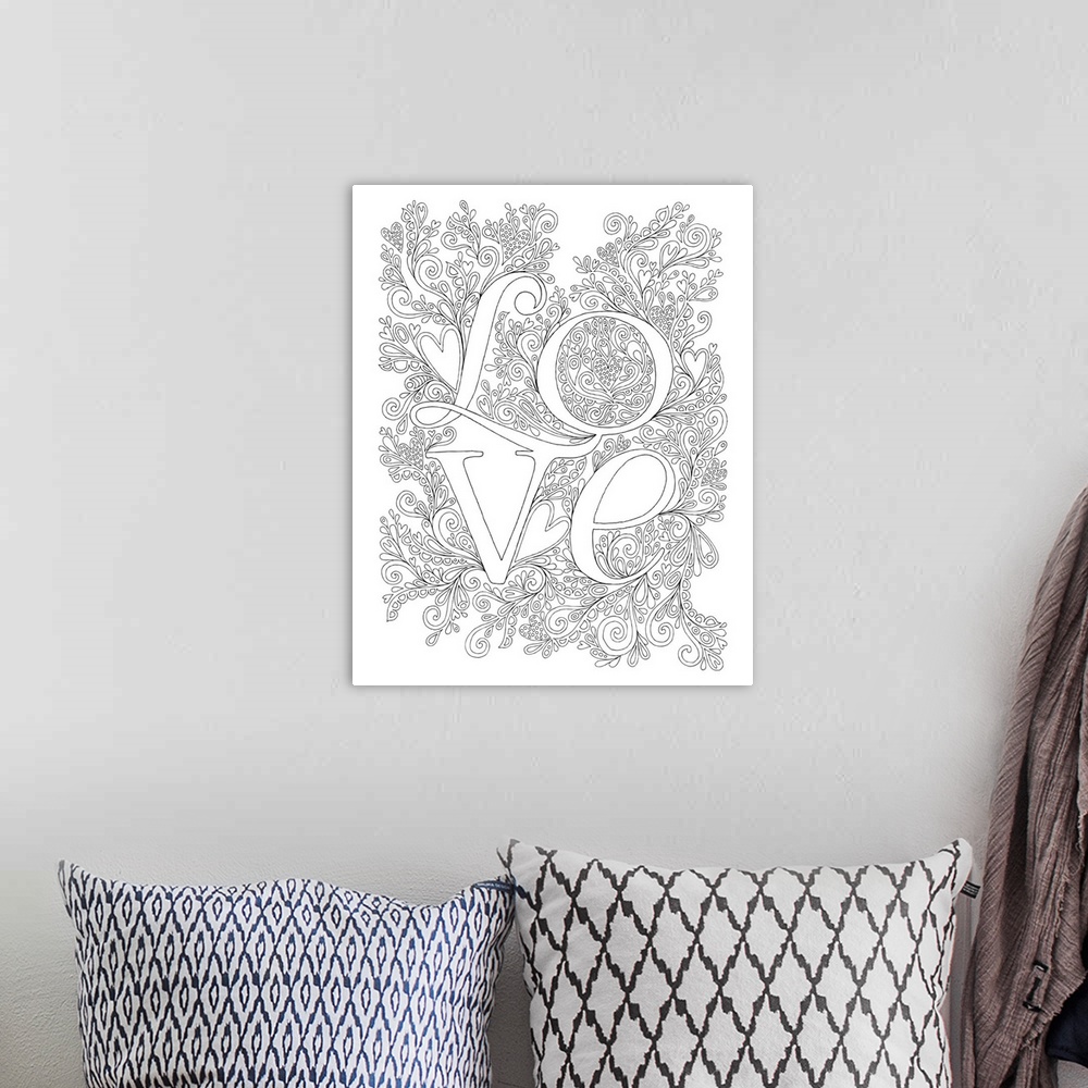 A bohemian room featuring Black and white line art of the word "Love" written on an intricately designed background.