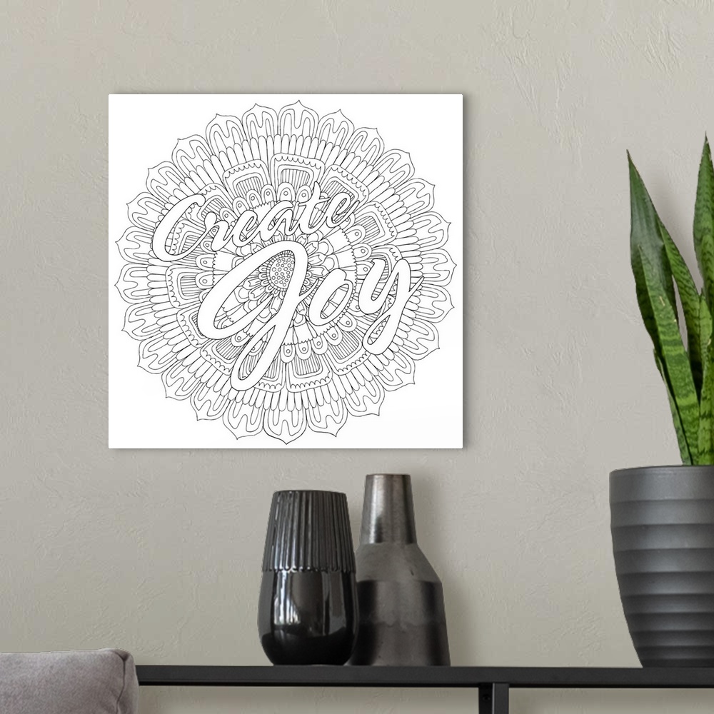 A modern room featuring Black and white line art with the phrase "Create Joy" written on top of a round floral design