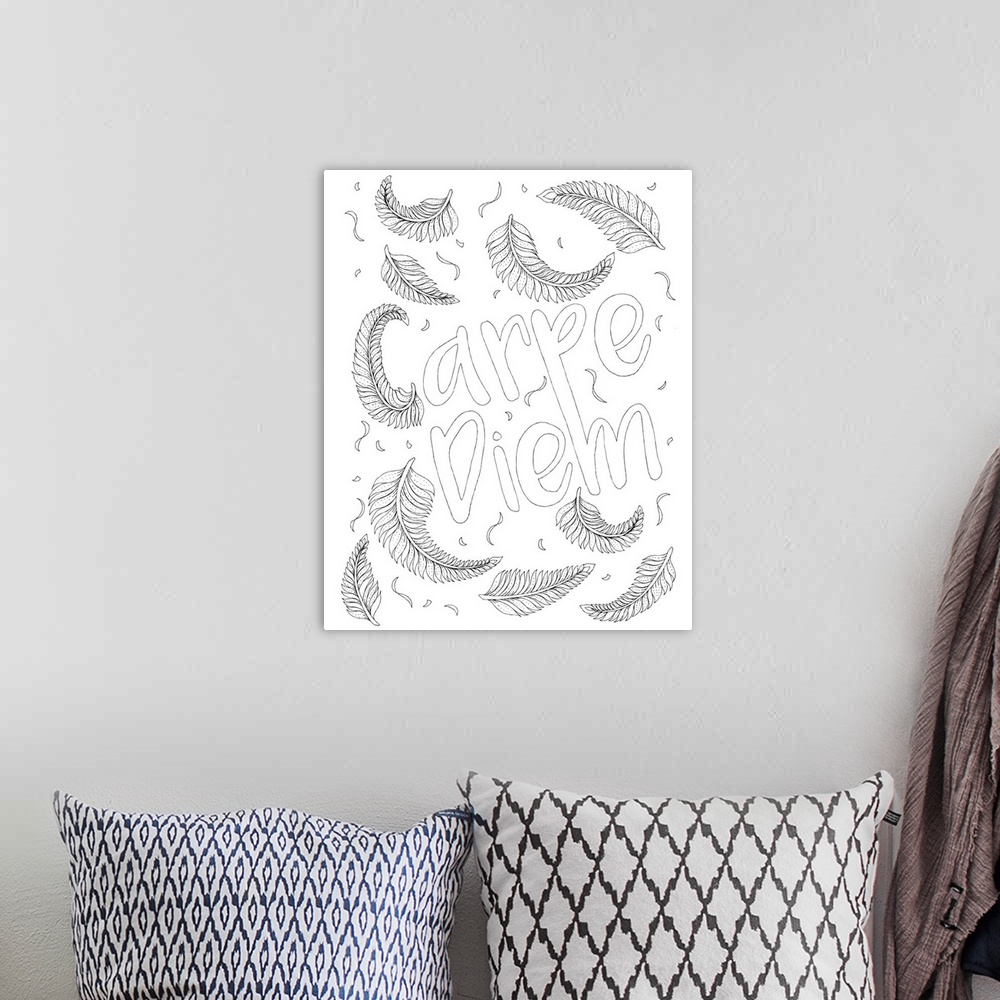 A bohemian room featuring Black and white line art with the phrase "Carpe Diem" surrounded by feathers.