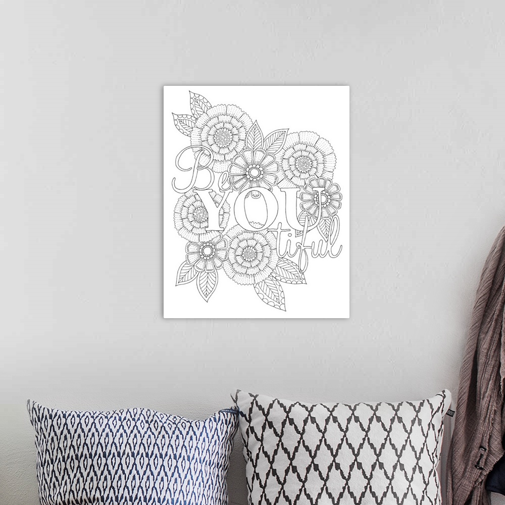 A bohemian room featuring Black and white line art with the phrase "Be you tiful" written on a floral background.