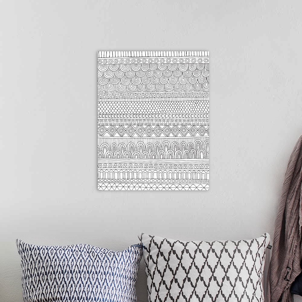 A bohemian room featuring Black and white line art with horizontal designed line patterns.