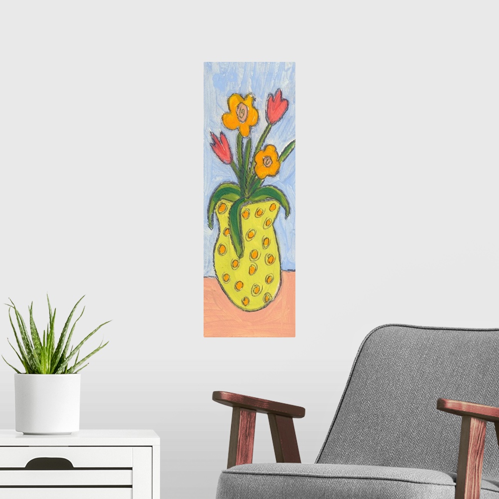 A modern room featuring A yellow polka-dotted vase of flowers.