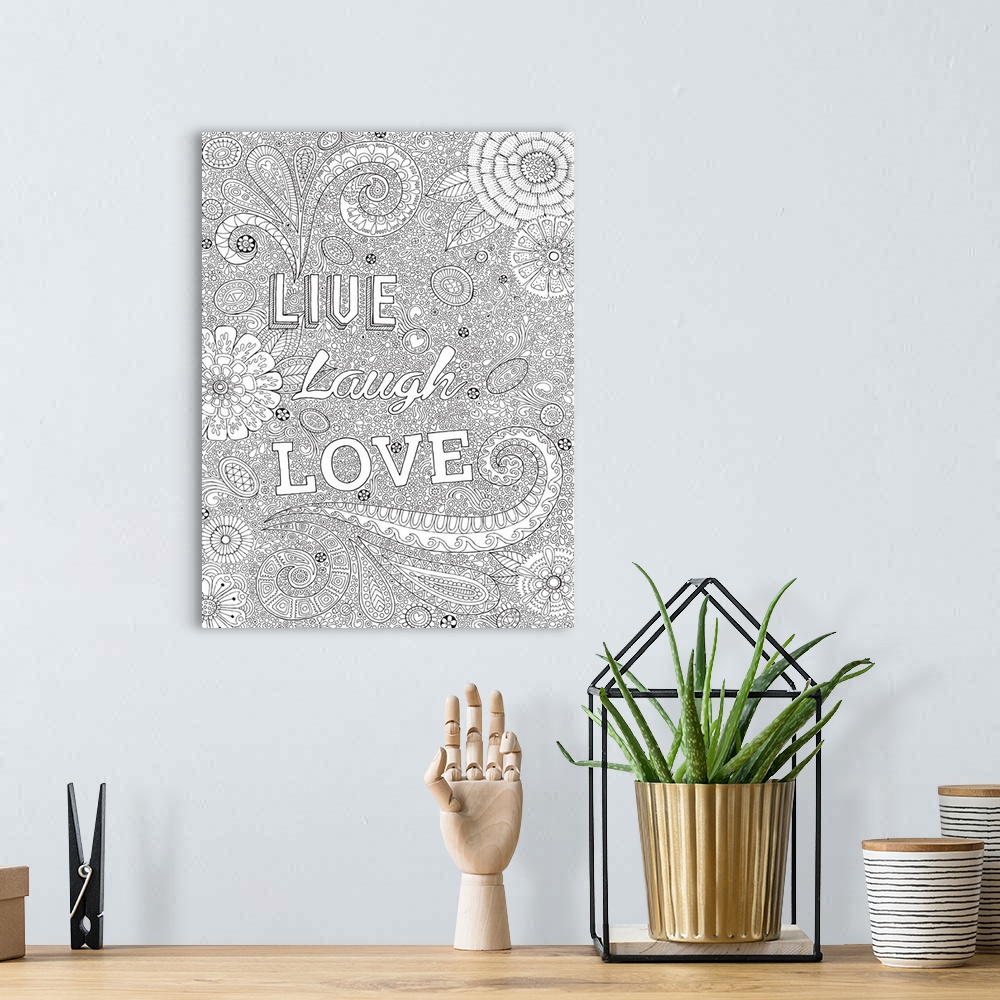 A bohemian room featuring Black and white line art with the phrase "Live Laugh Love" written on top of an intricately desig...