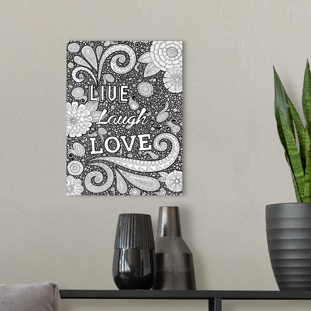 A modern room featuring Black and white line art with the phrase "Live Laugh Love" written on top of an intricately desig...