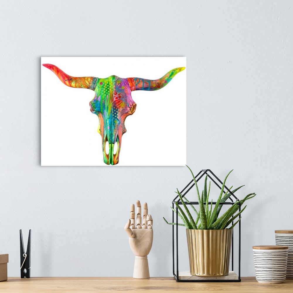 A bohemian room featuring Colorful painting of a longhorn skull covered in abstract designs on a solid white background.