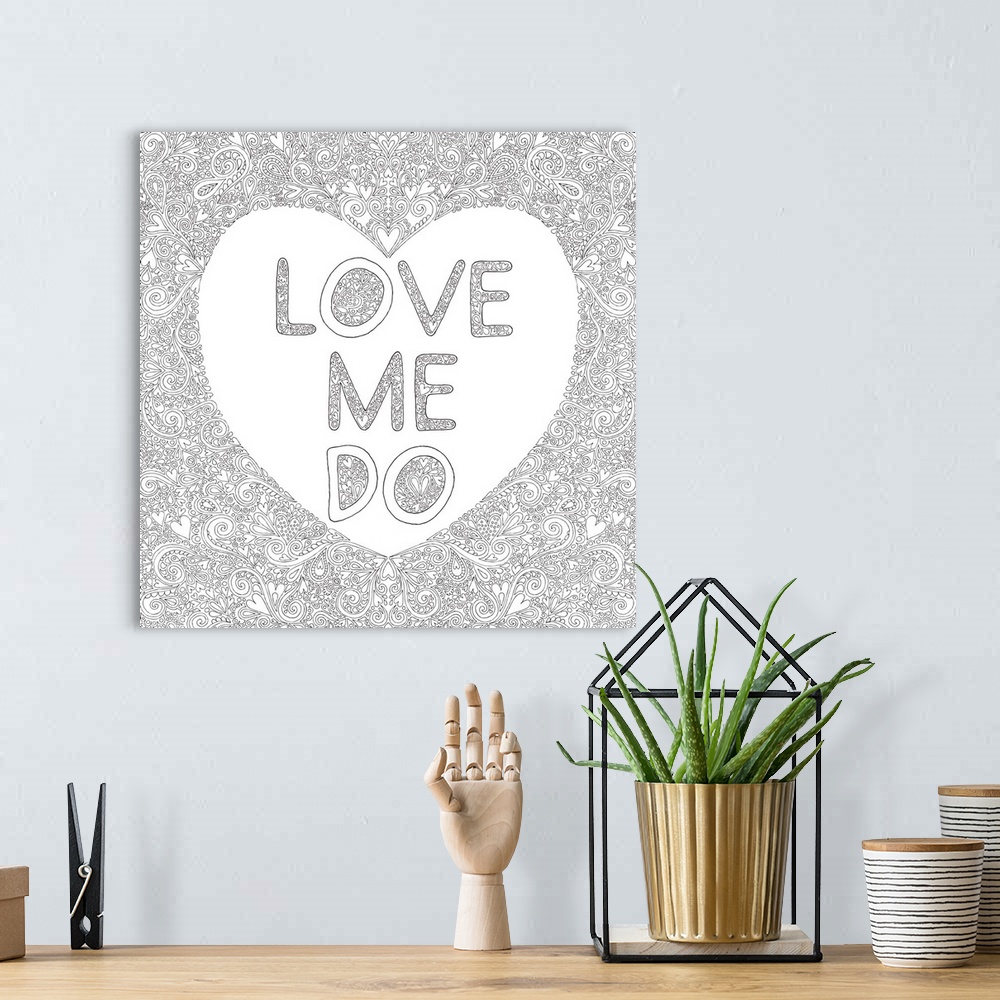 A bohemian room featuring Black and white line art with a white heart with the phrase "Love Me Do" written inside and surro...