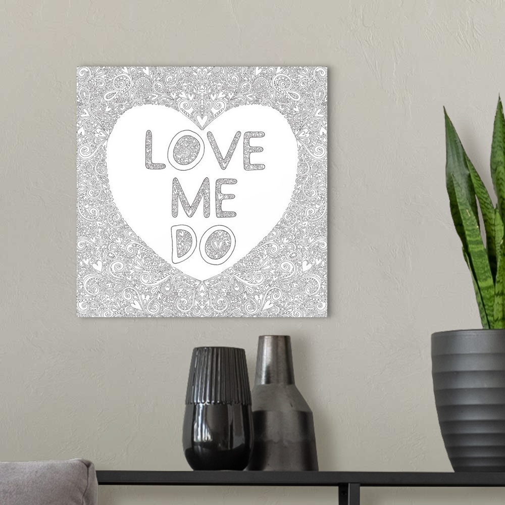 A modern room featuring Black and white line art with a white heart with the phrase "Love Me Do" written inside and surro...