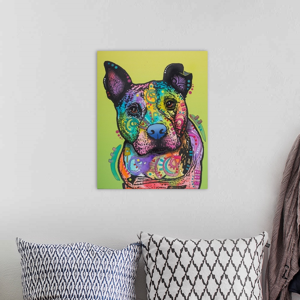 A bohemian room featuring Colorful painting of a pit bull covered in shaped designs on a yellow-green background.