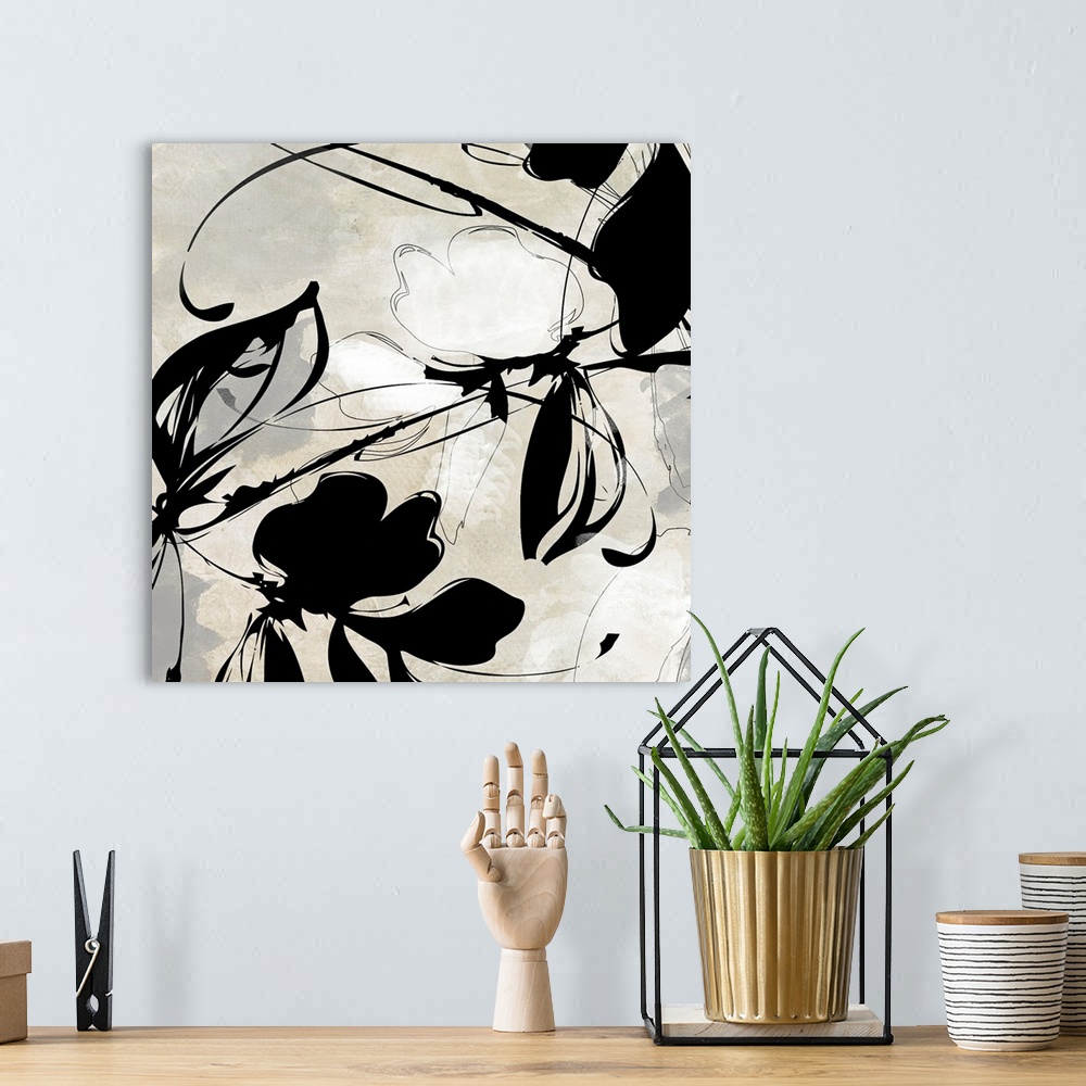 A bohemian room featuring Oversized, square wall art in black and white of a flower and ink design  on a light background.
