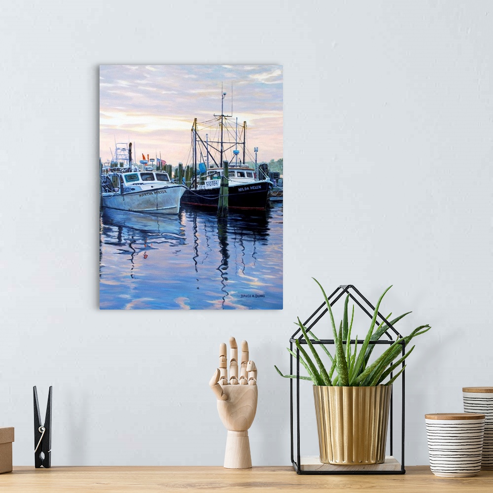 A bohemian room featuring Contemporary painting of two large boats docked to wooden pillars in the water in the early evening.
