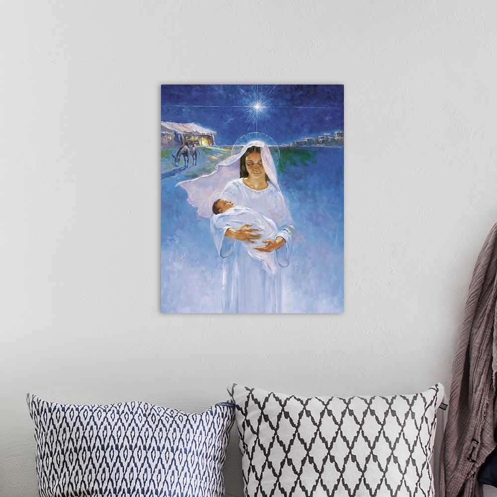 A bohemian room featuring Mary is pictured holding Jesus, the manger in which he was born is pictured in the background, as...