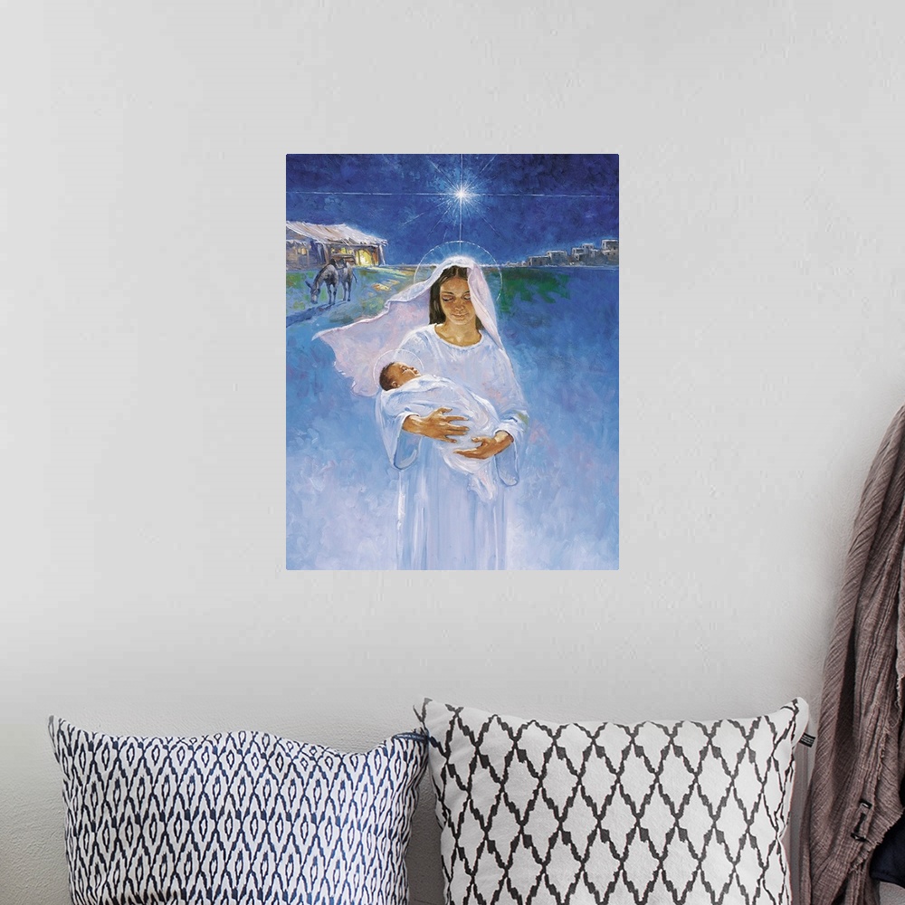 A bohemian room featuring Mary is pictured holding Jesus, the manger in which he was born is pictured in the background, as...