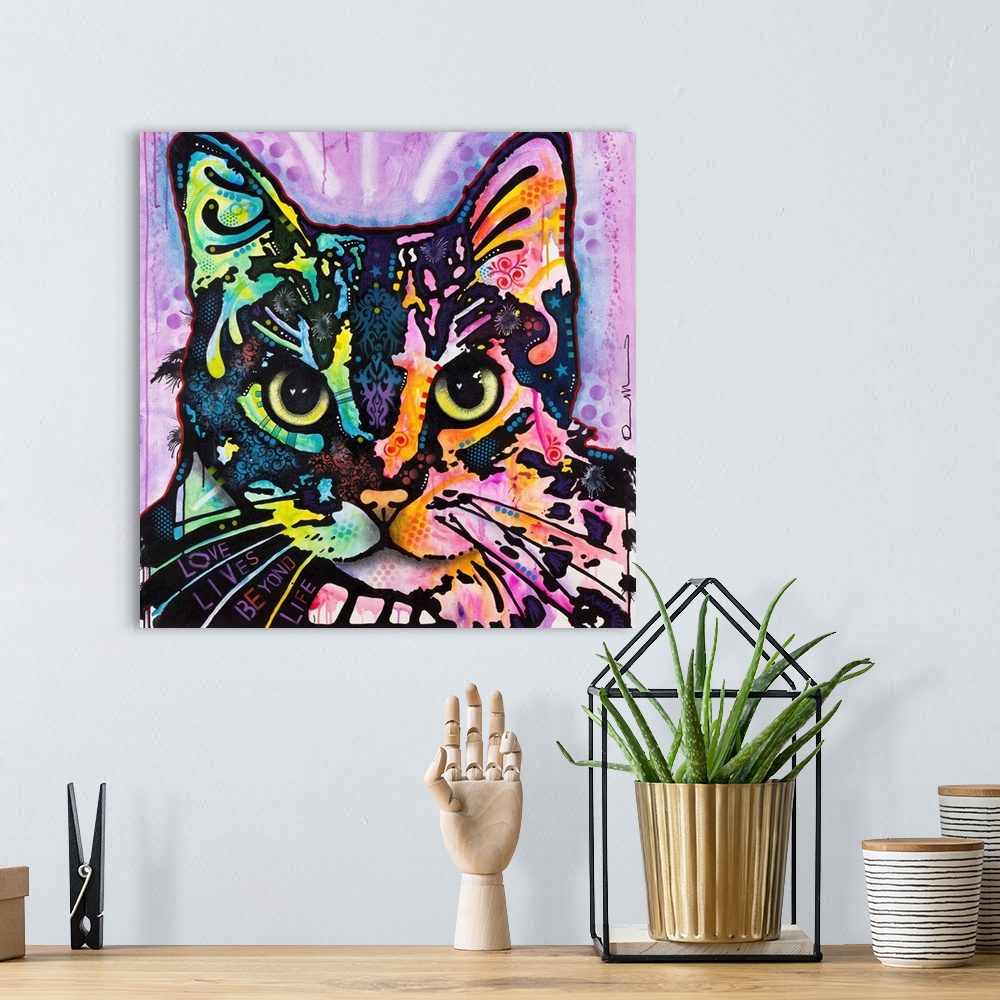 A bohemian room featuring Square art with an illustration of a cat with colorful abstract markings on a purple background.